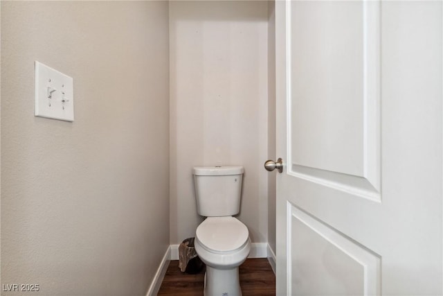 574 Desert Tortoise Way, Mesquite, NV 89027 - bathroom featuring baseboards, toilet, and wood finished floors