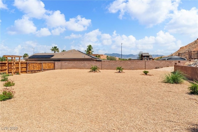 574 Desert Tortoise Way, Mesquite, NV 89027 - fenced backyard featuring a mountain view