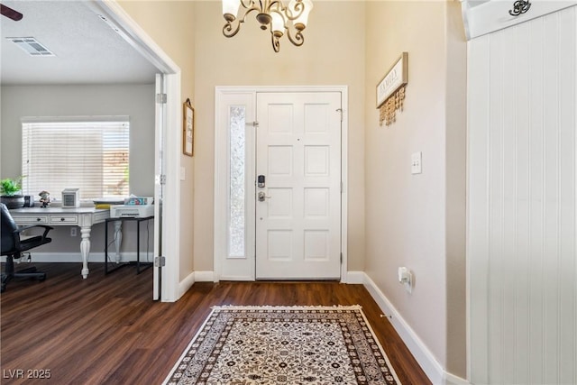 574 Desert Tortoise Way, Mesquite, NV 89027 - entryway with dark wood-style floors, a chandelier, and baseboards