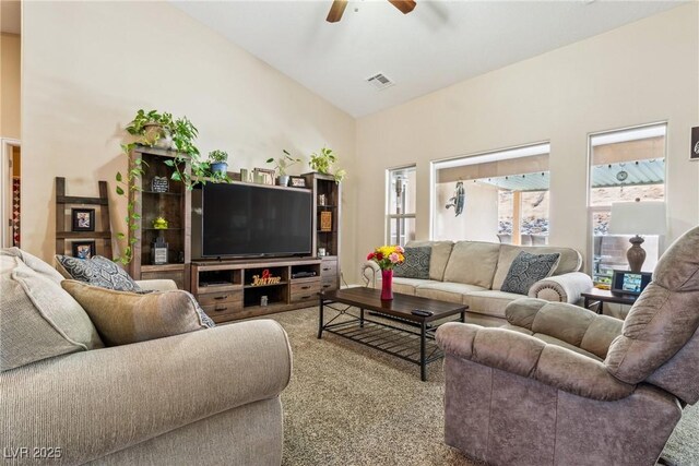 574 Desert Tortoise Way, Mesquite, NV 89027 - living room featuring a ceiling fan, vaulted ceiling, and carpet flooring