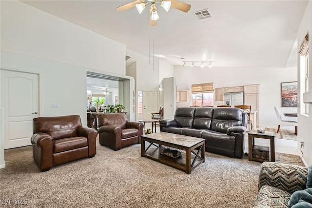 7515 Splashing Rock Dr, Las Vegas, NV 89131 - living room with ceiling fan, carpet floors, high vaulted ceiling, plenty of natural light, and track lighting