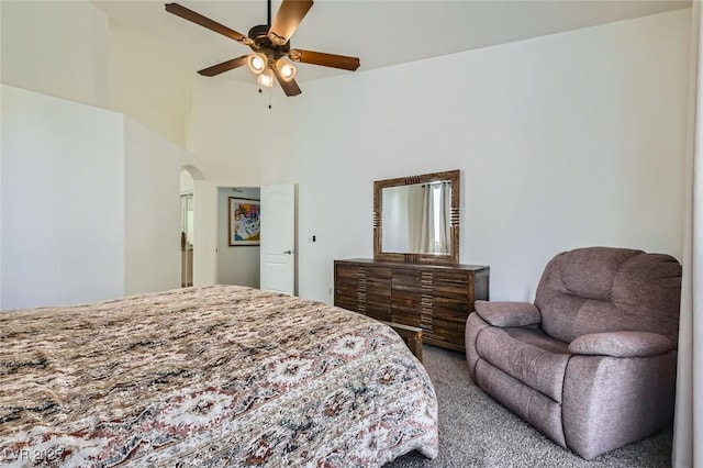 7515 Splashing Rock Dr, Las Vegas, NV 89131 - carpeted bedroom featuring arched walkways and ceiling fan