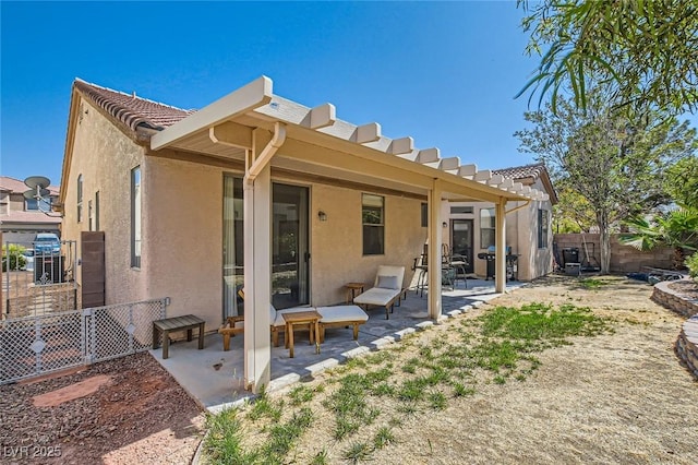 7515 Splashing Rock Dr, Las Vegas, NV 89131 - rear view of house featuring stucco siding, a fenced backyard, a patio, and a tiled roof