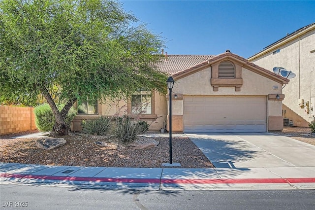 7515 Splashing Rock Dr, Las Vegas, NV 89131 - view of front of house featuring concrete driveway, stucco siding, an attached garage, and a tiled roof