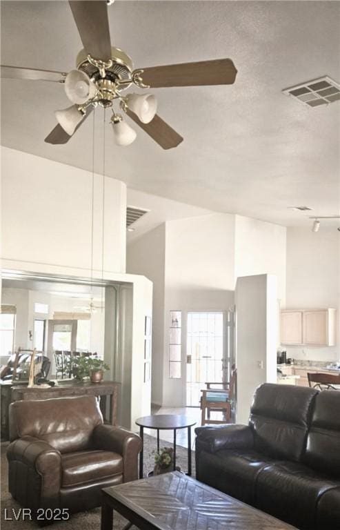 7515 Splashing Rock Dr, Las Vegas, NV 89131 - living area featuring a ceiling fan and a towering ceiling