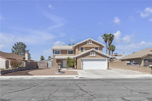 7197 Sixshooter Dr, Las Vegas, NV 89119 - view of front of property with a tile roof, stucco siding, concrete driveway, and an attached garage