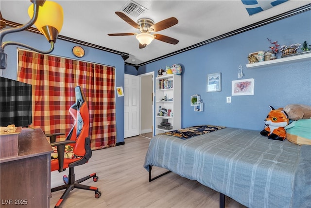 7197 Sixshooter Dr, Las Vegas, NV 89119 - bedroom with wood finished floors, a ceiling fan, an office area, and crown molding