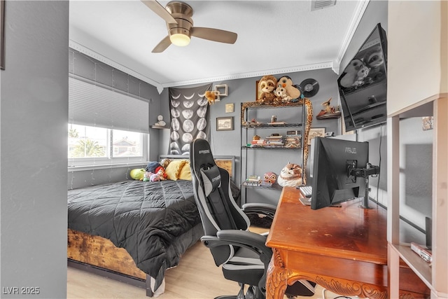 7197 Sixshooter Dr, Las Vegas, NV 89119 - bedroom with crown molding, a desk, a ceiling fan, and wood finished floors