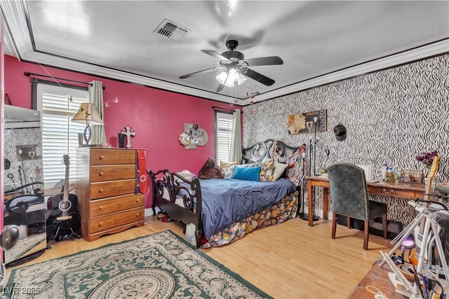 7197 Sixshooter Dr, Las Vegas, NV 89119 - bedroom with multiple windows, wood finished floors, a ceiling fan, and crown molding