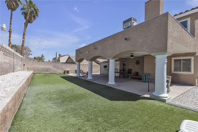 7197 Sixshooter Dr, Las Vegas, NV 89119 - rear view of property featuring stucco siding, ceiling fan, a patio area, and central air condition unit
