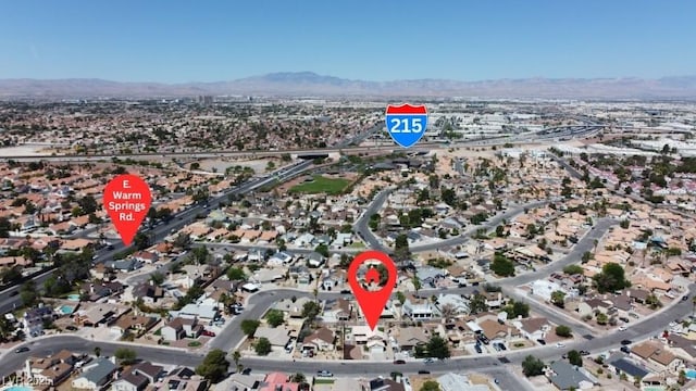 7197 Sixshooter Dr, Las Vegas, NV 89119 - aerial view of property and surrounding area featuring a mountainous background and nearby suburban area