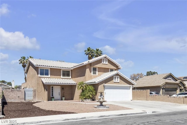 7197 Sixshooter Dr, Las Vegas, NV 89119 - view of front of house featuring a tiled roof, stucco siding, concrete driveway, and an attached garage