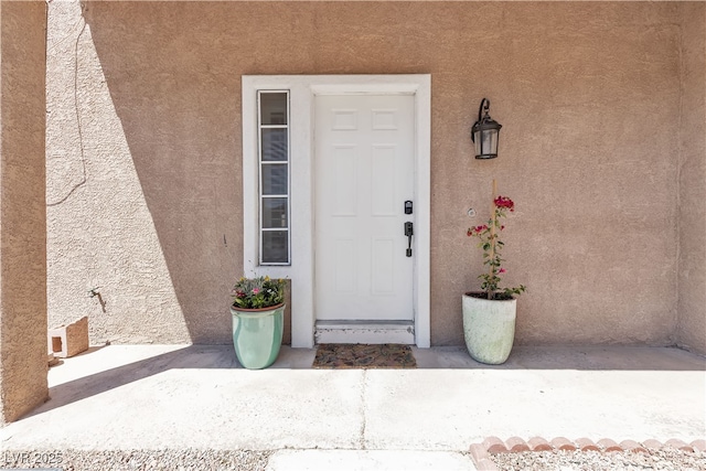 7197 Sixshooter Dr, Las Vegas, NV 89119 - property entrance featuring stucco siding