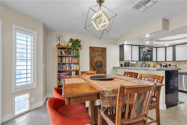 7197 Sixshooter Dr, Las Vegas, NV 89119 - dining area featuring light tile patterned floors, baseboards, and recessed lighting