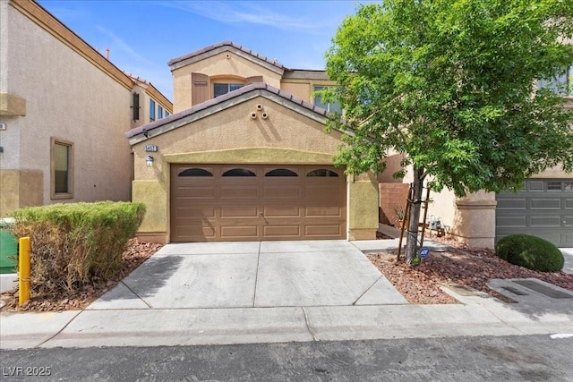 5452 Tinker Toy Ave, Las Vegas, NV 89139 - view of front of home with concrete driveway, stucco siding, and an attached garage