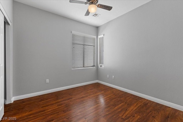 5452 Tinker Toy Ave, Las Vegas, NV 89139 - unfurnished room featuring baseboards, dark wood finished floors, and a ceiling fan