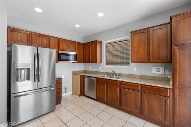 5452 Tinker Toy Ave, Las Vegas, NV 89139 - kitchen with stainless steel appliances, a sink, light countertops, recessed lighting, and light tile patterned floors