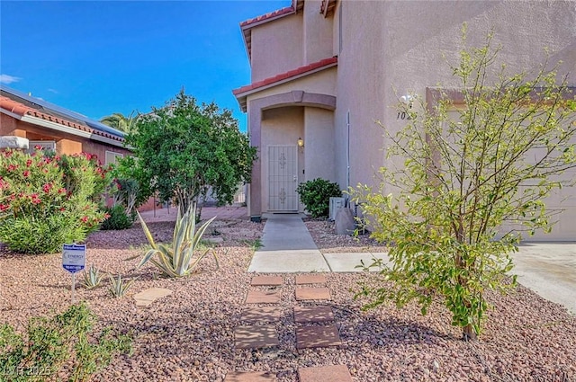 1025 Clover Tip Ct, Las Vegas, NV 89123 - doorway to property with stucco siding and a tiled roof