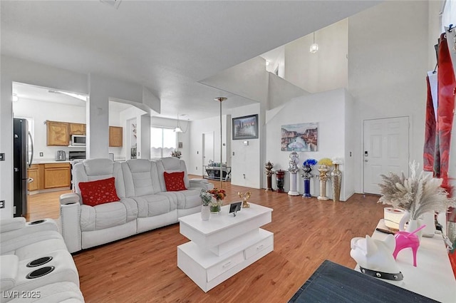1025 Clover Tip Ct, Las Vegas, NV 89123 - living room featuring light wood-style floors and a towering ceiling