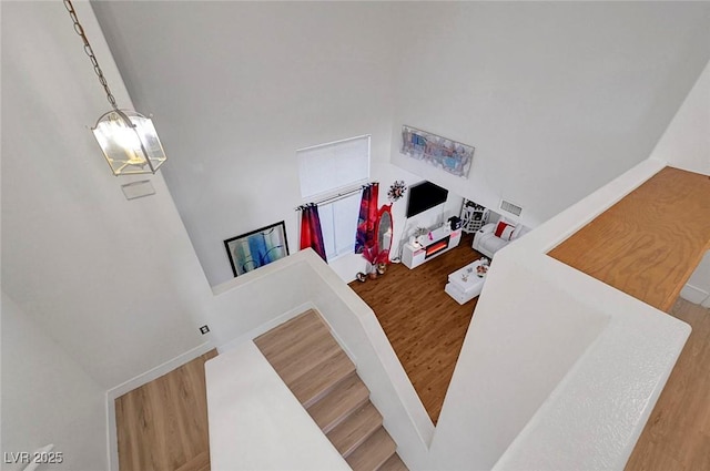 1025 Clover Tip Ct, Las Vegas, NV 89123 - stairway featuring wood finished floors and a chandelier