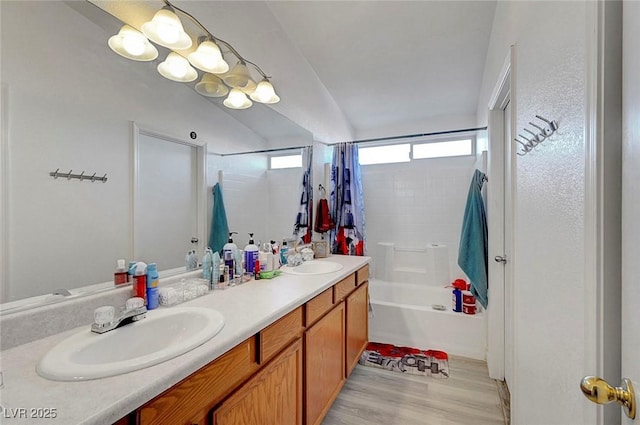 1025 Clover Tip Ct, Las Vegas, NV 89123 - full bathroom featuring double vanity, shower / tub combo with curtain, and wood finished floors