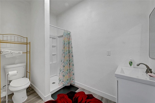 1025 Clover Tip Ct, Las Vegas, NV 89123 - bathroom featuring wood finished floors, toilet, a shower with curtain, vanity, and baseboards