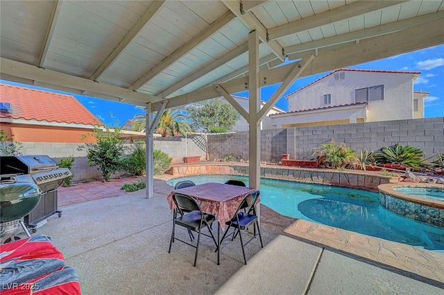 1025 Clover Tip Ct, Las Vegas, NV 89123 - view of swimming pool featuring a fenced backyard, a patio, a pool with connected hot tub, outdoor dining space, and grilling area