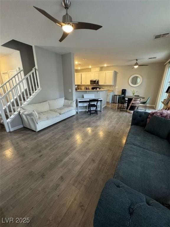 1355 Grass Creek Ave Unit 1, Henderson, NV 89012 - living room featuring a ceiling fan, dark wood-style floors, and stairway