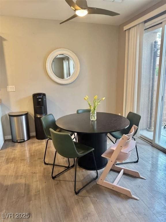 1355 Grass Creek Ave Unit 1, Henderson, NV 89012 - dining area with healthy amount of natural light, hardwood / wood-style floors, ceiling fan, and baseboards