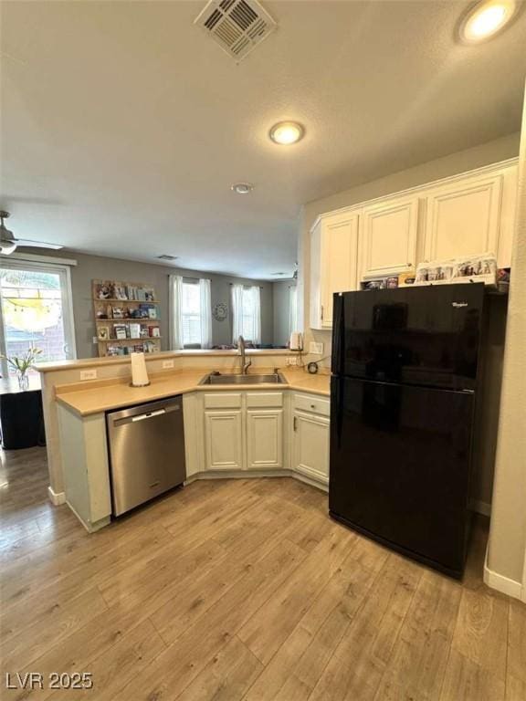 1355 Grass Creek Ave Unit 1, Henderson, NV 89012 - kitchen featuring freestanding refrigerator, stainless steel dishwasher, a sink, plenty of natural light, and recessed lighting
