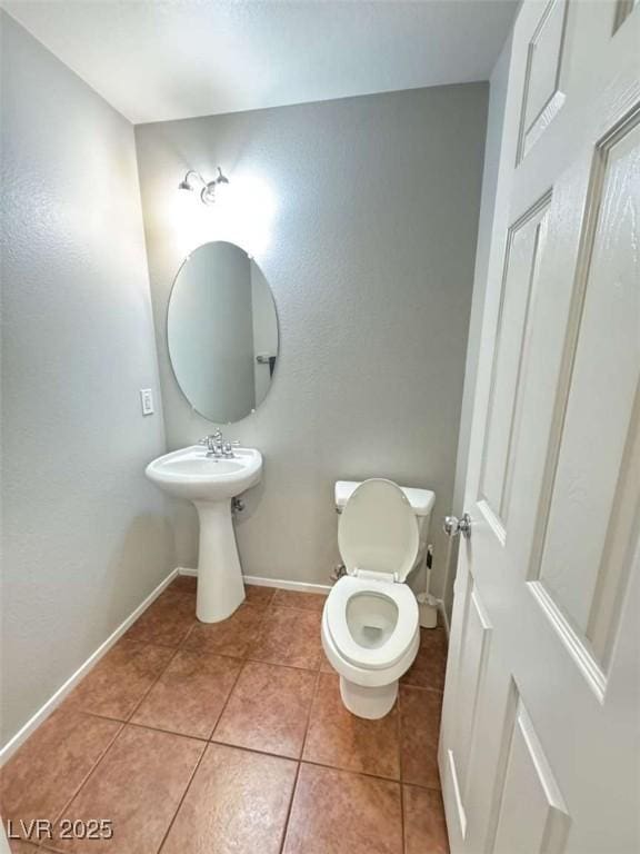 1355 Grass Creek Ave Unit 1, Henderson, NV 89012 - bathroom featuring tile patterned floors, toilet, and baseboards