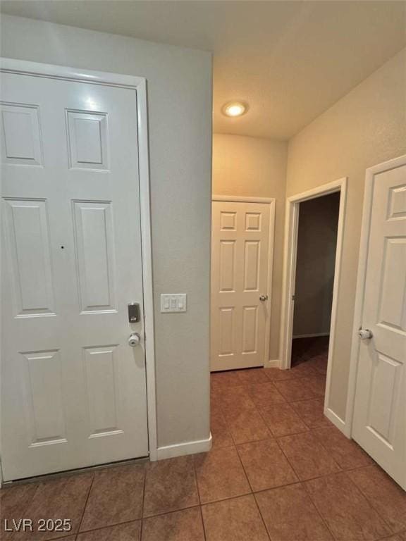 1355 Grass Creek Ave Unit 1, Henderson, NV 89012 - hallway featuring tile patterned flooring, baseboards, and recessed lighting