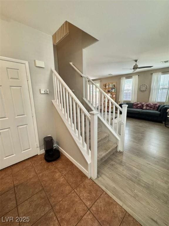 1355 Grass Creek Ave Unit 1, Henderson, NV 89012 - stairs featuring a ceiling fan, tile patterned floors, and baseboards