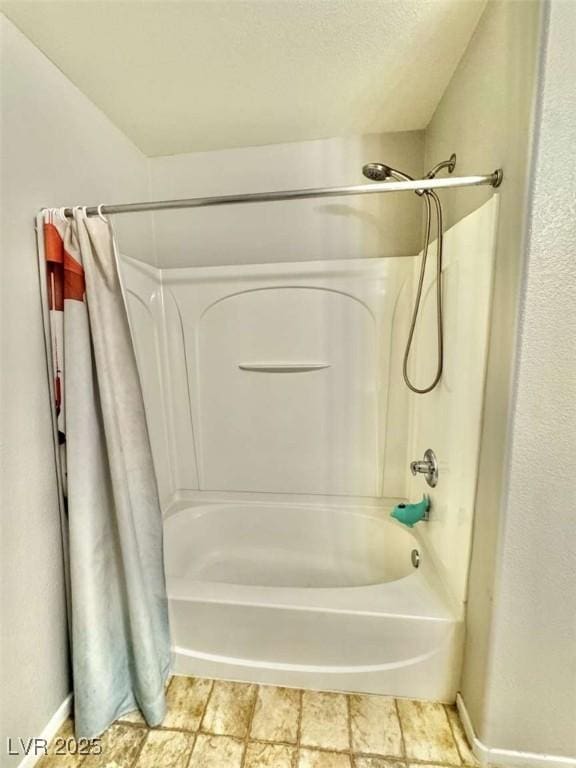 1355 Grass Creek Ave Unit 1, Henderson, NV 89012 - bathroom with shower / bath combo with shower curtain and baseboards