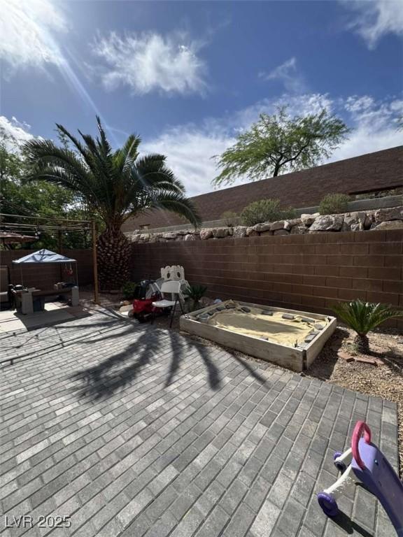 1355 Grass Creek Ave Unit 1, Henderson, NV 89012 - deck with a fenced backyard and a hot tub