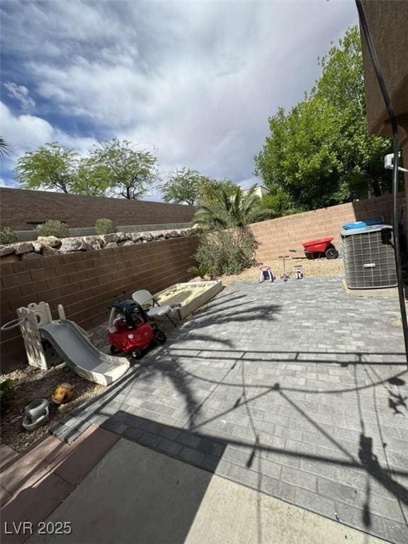 1355 Grass Creek Ave Unit 1, Henderson, NV 89012 - fenced backyard featuring a patio and central air condition unit