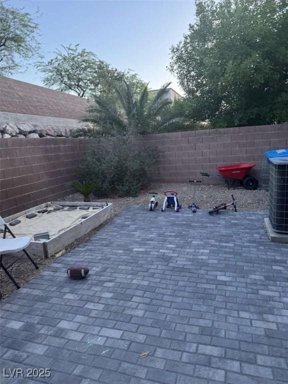 1355 Grass Creek Ave Unit 1, Henderson, NV 89012 - fenced backyard featuring cooling unit and a patio