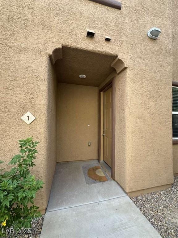 1355 Grass Creek Ave Unit 1, Henderson, NV 89012 - doorway to property featuring stucco siding