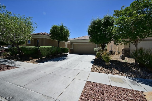 7727 Widewing Dr, North Las Vegas, NV 89084 - view of front of house featuring concrete driveway, an attached garage, and stucco siding