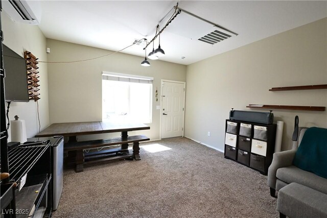7727 Widewing Dr, North Las Vegas, NV 89084 - carpeted dining area with a wall unit AC