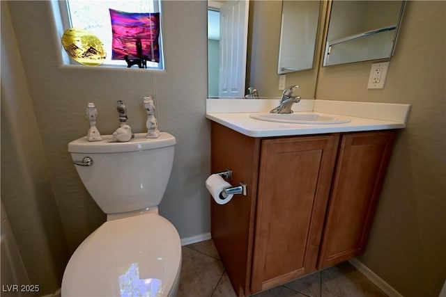 7727 Widewing Dr, North Las Vegas, NV 89084 - half bathroom featuring toilet, vanity, tile patterned floors, and baseboards
