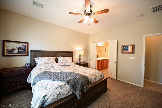 7727 Widewing Dr, North Las Vegas, NV 89084 - carpeted bedroom featuring baseboards, connected bathroom, and a ceiling fan