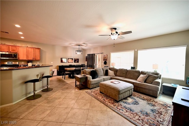 7727 Widewing Dr, North Las Vegas, NV 89084 - living area with a ceiling fan, light tile patterned flooring, recessed lighting, and baseboards
