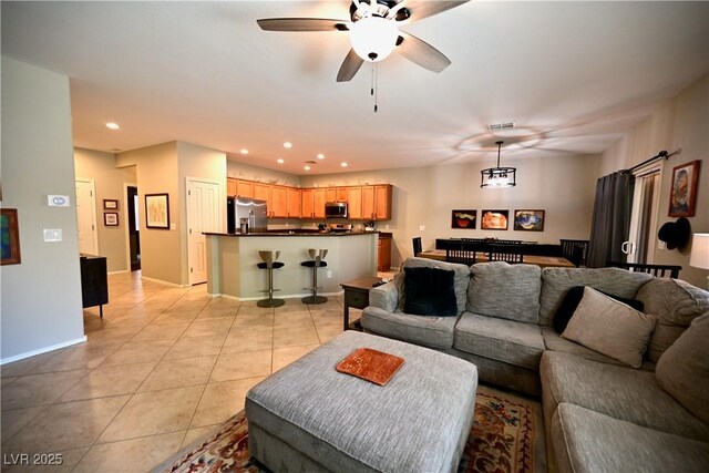 7727 Widewing Dr, North Las Vegas, NV 89084 - living area with a ceiling fan, light tile patterned floors, recessed lighting, and baseboards
