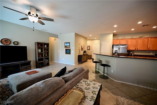 7727 Widewing Dr, North Las Vegas, NV 89084 - living room featuring light tile patterned floors, a ceiling fan, recessed lighting, and baseboards