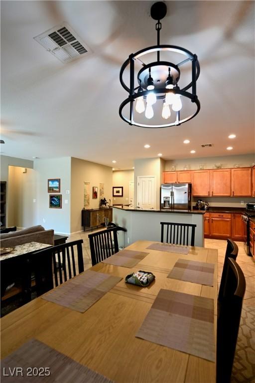 7727 Widewing Dr, North Las Vegas, NV 89084 - dining area with a chandelier and recessed lighting