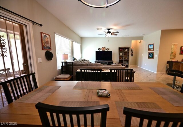7727 Widewing Dr, North Las Vegas, NV 89084 - dining space featuring a ceiling fan, light tile patterned flooring, and baseboards