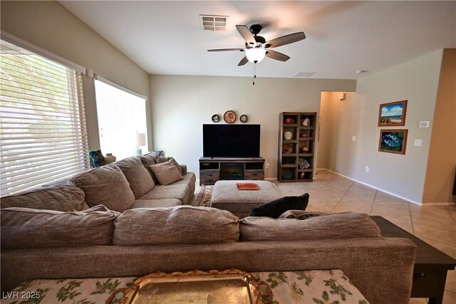 7727 Widewing Dr, North Las Vegas, NV 89084 - living area with a ceiling fan, light tile patterned flooring, and baseboards