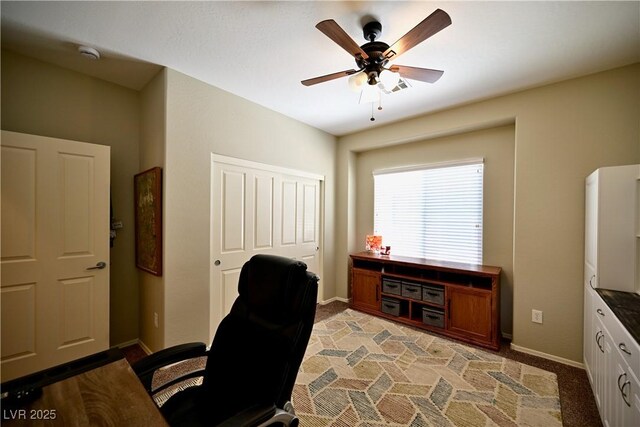 7727 Widewing Dr, North Las Vegas, NV 89084 - office space with a ceiling fan, baseboards, and light carpet