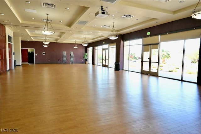 7727 Widewing Dr, North Las Vegas, NV 89084 - workout room with coffered ceiling and wood finished floors